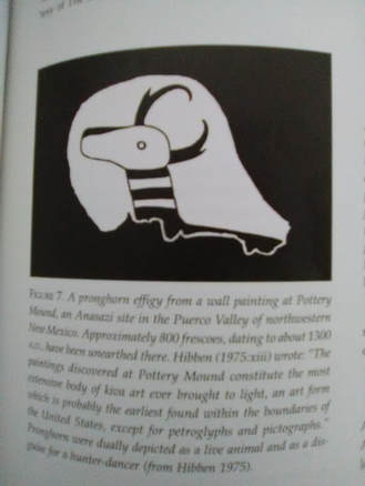 Screenshot of a page from a book. Text is fuzzy, not legible (and not the purpose of the image). Image depicts a jagged white background, over which is drawn a stylized pronghorn (aka antelope) head, neck, and withers.