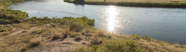 Image of a wide-open river in the sunlight